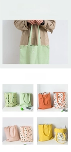 Detail of canvas tote bags with wide handles in avocado, citrus, peach, and lemon patterns