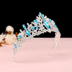 Macro shot of silver bridal crown featuring light blue crystals and white rhinestones