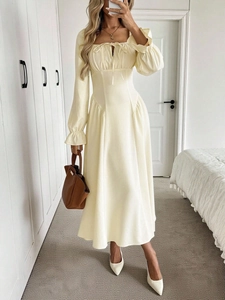 Elegant cream square neck maxi dress with lantern sleeves and tie-waist pleated design