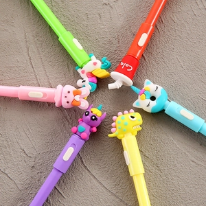 Set of six glowing cartoon neutral pens with cute animal toppers on gray background