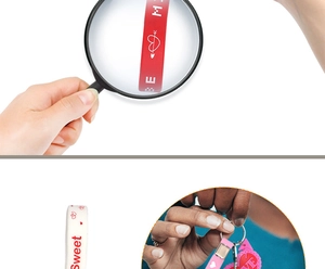 Close-up of silicone heart keychains with Sweet and Love text for Valentine's gifts