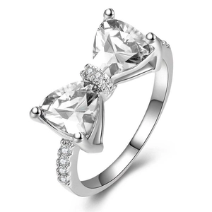 Luxury silver bow ring with triangle zircon stones and shimmering pavé setting