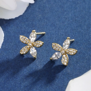Luxury gold flower stud earrings with marquise and round cubic zirconia stones
