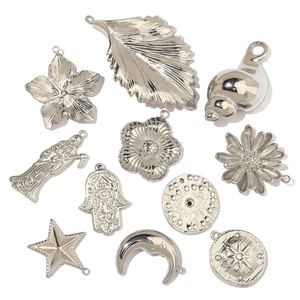 Collection of silver stainless steel charms featuring feather, hand, and star moon shapes