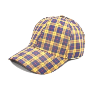 Detail of multi-color plaid baseball cap featuring yellow, blue, and red checkered pattern