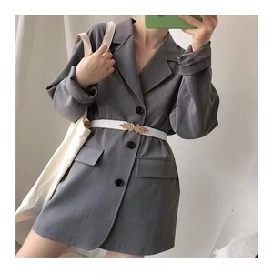 Gray blazer dress paired with a white waist belt featuring a gold leaf shaped buckle