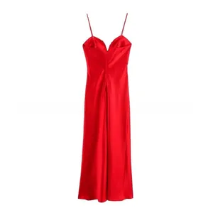 Close-up of bright red satin midi dress showing silky texture and thin strap detail