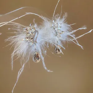 Exquisite white feather swan wing earrings with teardrop crystal pendants for women