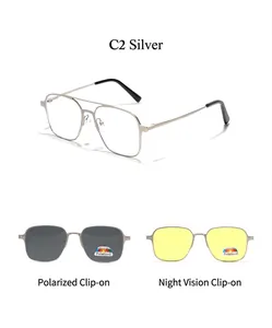 Close-up of magnetic clip-on system with dark gray polarized and yellow night vision lenses