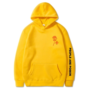 Detail of yellow hoodie with rose print and People Are Poison sleeve text