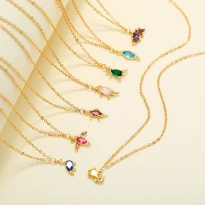 18K gold-plated necklace featuring a cartoon dinosaur pendant with colorful gemstones