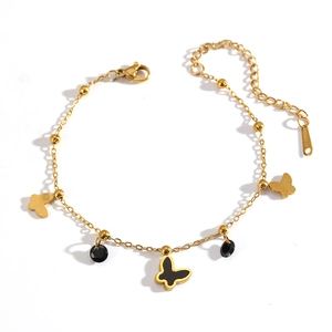 Bracelet élégant en acier inoxydable doré avec des breloques papillon et perles noires