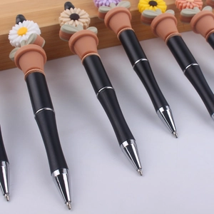 Creative sunflower flowerpot silicone bead pens with black barrels and metallic accents