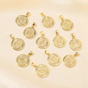 Set of 12 circular 18k gold plated zodiac charms with embossed constellations on silk