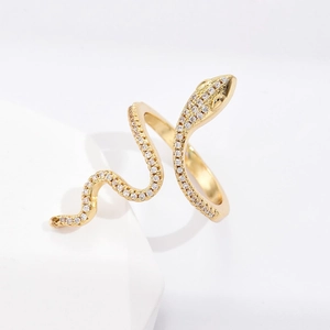 Detailed view of snake-shaped ring in 18K gold plating with sparkling white zircon stones