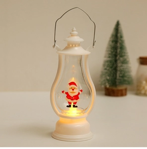 Close-up of white LED Christmas lantern with Santa Claus figure and warm yellow light