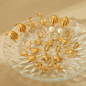 9 pairs of 18K gold plated stainless steel ocean earrings featuring starfish, crab and shell