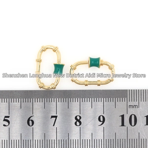 18K gold-plated oval screw clasp with green enamel showing open and closed mechanism