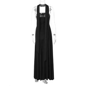 Detail view of black halter neck dress featuring elegant long ribbons and flowing fabric