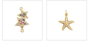 Macro shot of gold-plated star and starfish pendants with colorful cubic zirconia