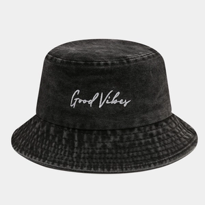 Detail of Good Vibes embroidery on charcoal washed denim bucket hat with vintage texture