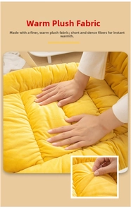 Close-up of ginger plush heated seat cushion showing soft fabric texture and rebound effect