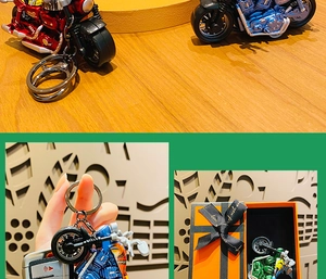 Detail of colorful alloy motorcycle keychains in red blue and green with realistic parts