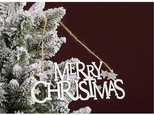 Macro detail of wooden Merry Christmas sign with silver glitter stars on tree branch