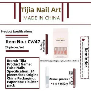 Detail view of 24pcs pink fake nail set with rhinestones and 1g glue in retail packaging