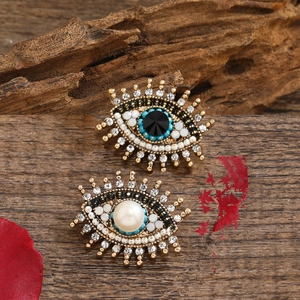 Vintage evil eye brooches with freshwater pearls and rhinestones on gold base