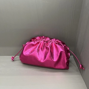 Magenta cloud clutch bag with metallic pleated finish and drawstring detail for women