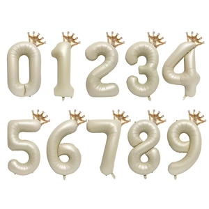 Creamy beige 40-inch number balloons set with golden crowns for baby birthday decor