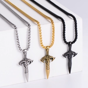 Three vintage stainless steel sword pendants with sheep head in silver, gold, and black colors