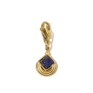 Detail of a gold-plated stainless steel charm with deep blue stone and lobster clasp