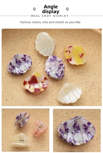 Detail view of mini shell hair claws with marble textures and strong metal springs