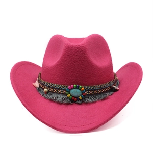 Detail of rose red wool cowboy hat featuring bohemian beaded band and turquoise stone