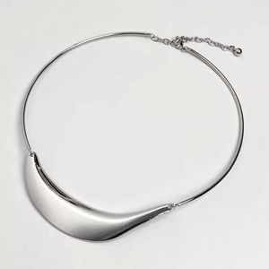 Detailed view of a silver metallic tube snake chain collar with an adjustable extension chain