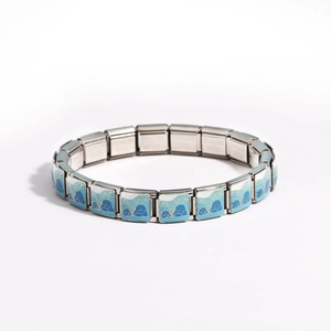 Detail of blue enamel seal charm on a modular stainless steel expandable bracelet