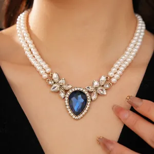 Vintage double layer pearl necklace with teardrop blue crystal and silver rhinestone studs