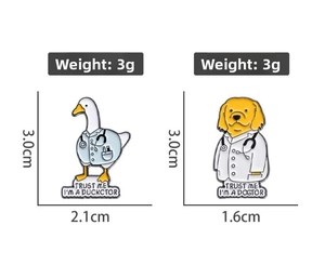 Detail showing dimensions of creative Duckctor and Dogtor cartoon enamel pins