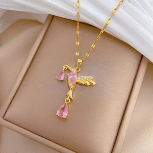 Elegant gold titanium necklace featuring a sparkling pink zircon hummingbird pendant