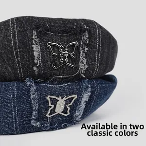 Detail of denim headbands with vintage frayed edges and metallic butterfly accents