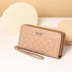 Detail of beige double zipper long wallet with diamond lattice stitching and wrist strap