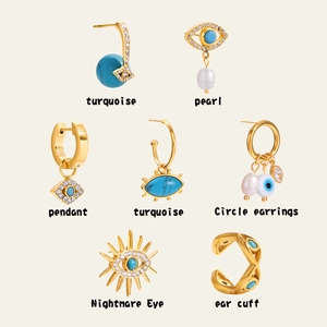Detail view of gold Evil Eye earring set with turquoise, pearls and rhinestones