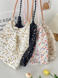 Floral canvas tote bags with drawstring and woven straps in various colorful patterns