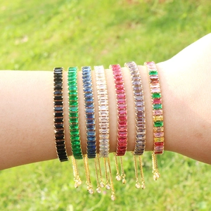 Detailed view of colorful rectangular zircon tennis bracelets with adjustable chains