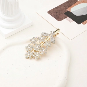 Exquisite gold alloy hair clip with shimmering rhinestones in a floral cluster design