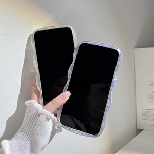Detail of two wavy transparent iPhone cases in clear and purple edge held by hand