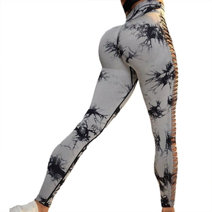 High-waisted tie-dye yoga leggings with hollow-out lace-up sides and peach butt-lift effect