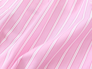 Macro detail of the high-quality pink and white striped cotton fabric texture